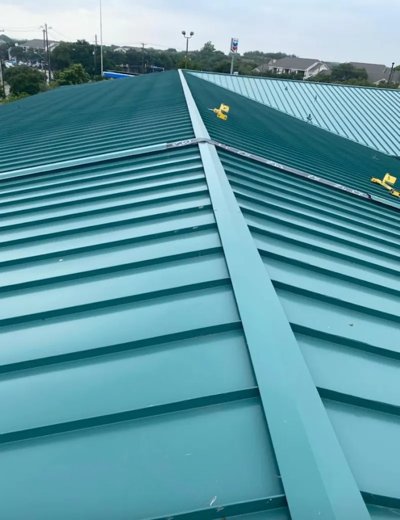 Green commercial metal roof ridge and valley for Metal Roof Repair in Hillsdale